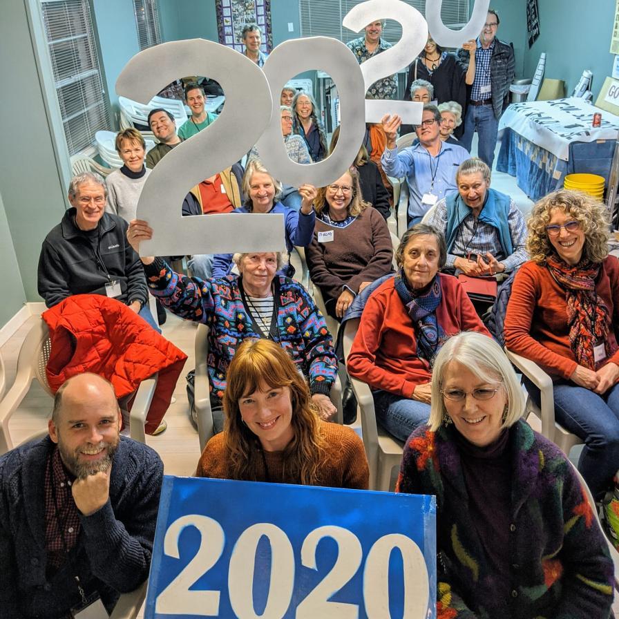Image of Indivisible group members holding "2020" signs